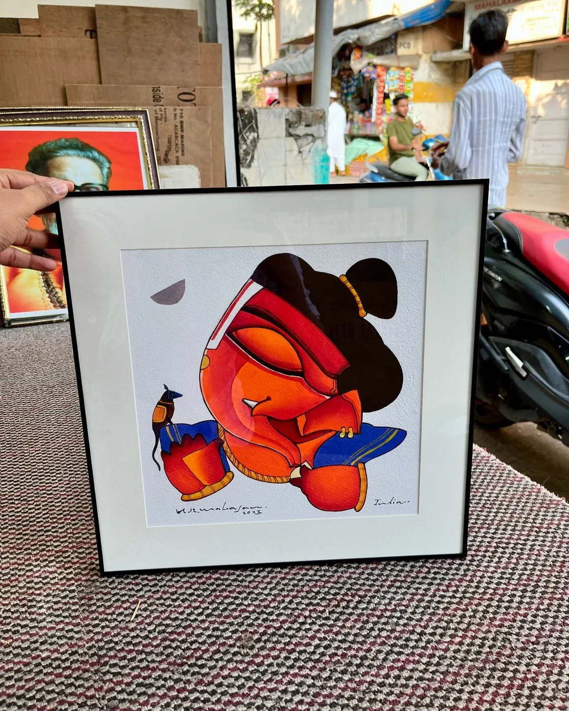 Artwork in an off-white mount and black frame